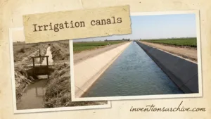 Irrigation canal with water flowing between concrete banks in a field.