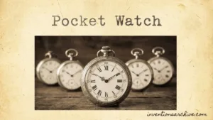 A vintage pocket watch with Roman numerals and a chain, showcasing the classic ICAT design.